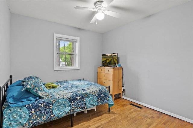 12 Debragga Ave, East Moriches, NY 11940 - bedroom with wood finished floors, baseboards, and ceiling fan
