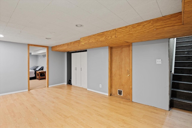 12 Debragga Ave, East Moriches, NY 11940 - finished basement featuring light wood finished floors, stairway, and baseboards