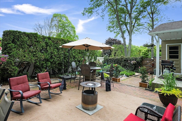 12 Debragga Ave, East Moriches, NY 11940 - fenced backyard with a patio area, a gate, and grilling area