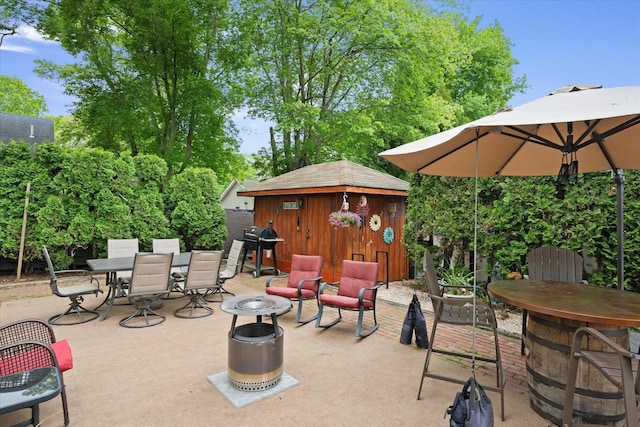 12 Debragga Ave, East Moriches, NY 11940 - view of patio featuring outdoor dining area, a grill, and an outbuilding