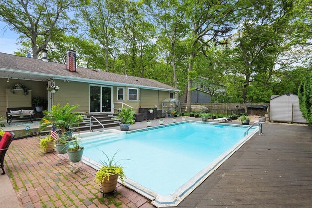 12 Debragga Ave, East Moriches, NY 11940 - view of swimming pool with entry steps, a fenced backyard, outdoor lounge area, and a patio area