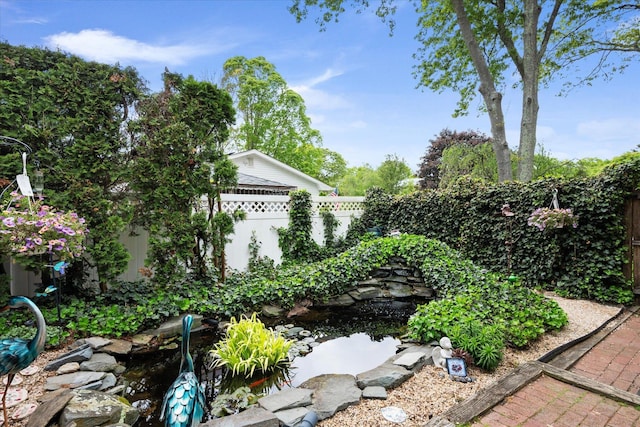 12 Debragga Ave, East Moriches, NY 11940 - fenced backyard with a small pond