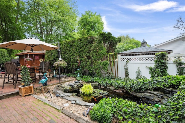 12 Debragga Ave, East Moriches, NY 11940 - view of yard featuring a gazebo, a patio area, and a small pond