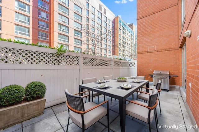 555 W 23rd St Unit S3Q, New York Manhattan, NY 10011 - view of patio / terrace featuring a grill, outdoor dining area, and a fenced backyard