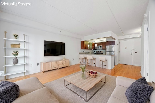 555 W 23rd St Unit S3Q, New York Manhattan, NY 10011 - living room with light wood-type flooring