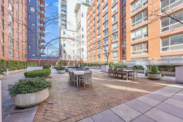555 W 23rd St Unit S3Q, New York Manhattan, NY 10011 - view of home's community featuring outdoor dining space and fence