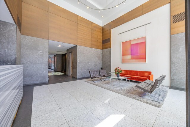 555 W 23rd St Unit S3Q, New York Manhattan, NY 10011 - building lobby featuring a high ceiling