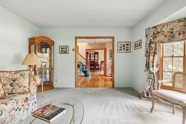 18 Stuyvesant Cir E, East Setauket, NY 11733 - living area with carpet and a chandelier