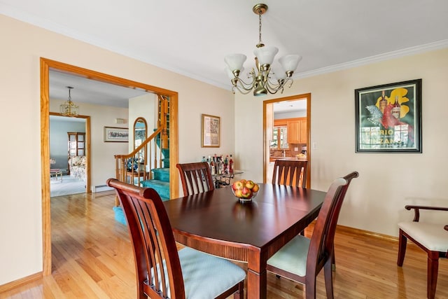 18 Stuyvesant Cir E, East Setauket, NY 11733 - dining area featuring a chandelier, light wood-style floors, stairway, ornamental molding, and baseboard heating