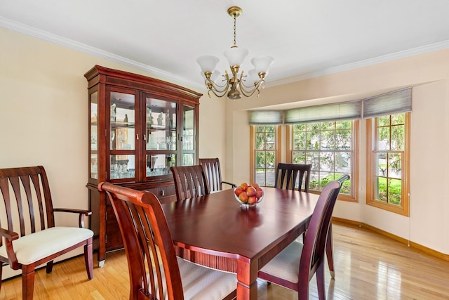 18 Stuyvesant Cir E, East Setauket, NY 11733 - dining room with a chandelier, plenty of natural light, light wood-type flooring, and ornamental molding