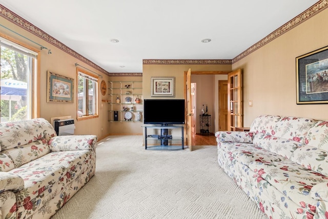 18 Stuyvesant Cir E, East Setauket, NY 11733 - carpeted living area featuring ornamental molding and baseboards