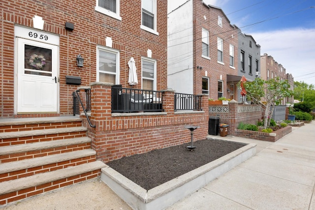 69-59 74th St, Middle Village, NY 11379 - entrance to property featuring brick siding
