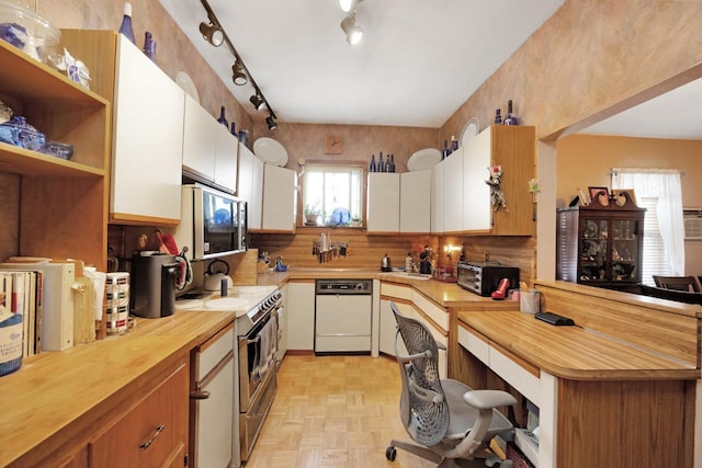 69-59 74th St, Middle Village, NY 11379 - kitchen with white dishwasher, wood counters, white cabinetry, and range with electric cooktop