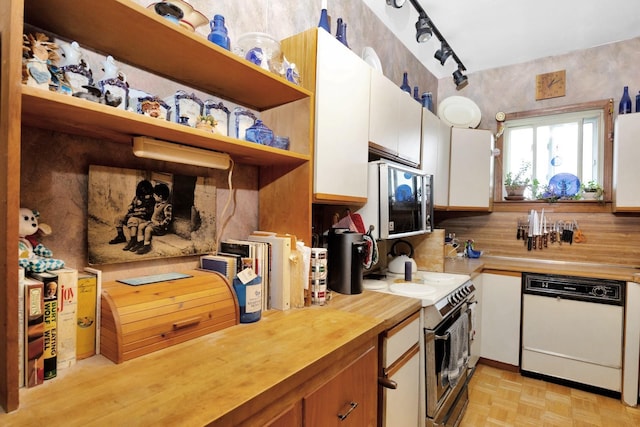 69-59 74th St, Middle Village, NY 11379 - kitchen with white appliances, wood counters, open shelves, and white cabinetry