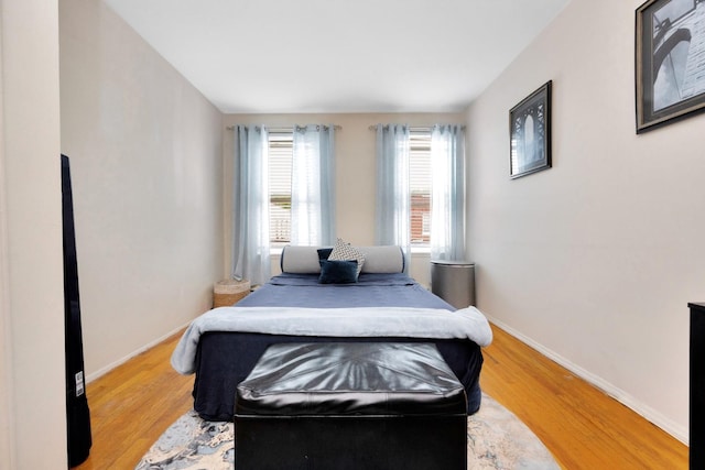 69-59 74th St, Middle Village, NY 11379 - bedroom featuring wood finished floors and baseboards