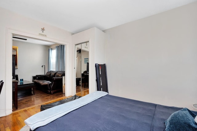 69-59 74th St, Middle Village, NY 11379 - bedroom with wood finished floors and a closet