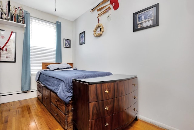 69-59 74th St, Middle Village, NY 11379 - bedroom featuring light wood-style floors