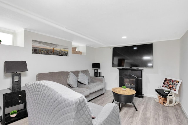 69-59 74th St, Middle Village, NY 11379 - living room featuring wood finished floors, baseboards, recessed lighting, crown molding, and a glass covered fireplace