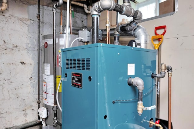 69-59 74th St, Middle Village, NY 11379 - utility room featuring water heater
