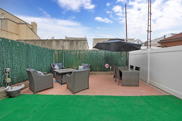 69-59 74th St, Middle Village, NY 11379 - view of patio with a fenced backyard and an outdoor hangout area