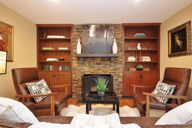 4 Southview Rd, Chappaqua, NY 10514 - living area with light wood-style flooring, built in shelves, and a fireplace