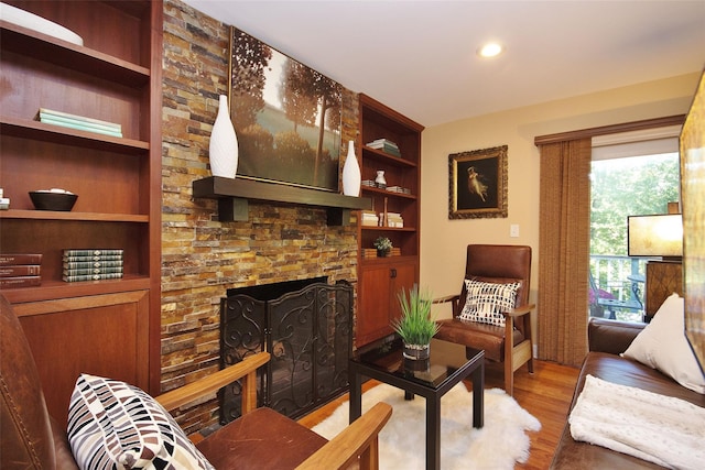 4 Southview Rd, Chappaqua, NY 10514 - living room featuring wood finished floors, built in features, recessed lighting, and a fireplace