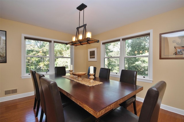 4 Southview Rd, Chappaqua, NY 10514 - dining area with baseboards, dark wood-style floors, and a chandelier
