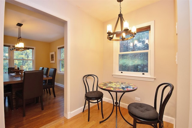 4 Southview Rd, Chappaqua, NY 10514 - dining area with a chandelier, light wood finished floors, and baseboards
