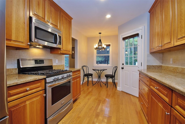 4 Southview Rd, Chappaqua, NY 10514 - kitchen featuring appliances with stainless steel finishes, light wood-type flooring, brown cabinetry, baseboards, and recessed lighting