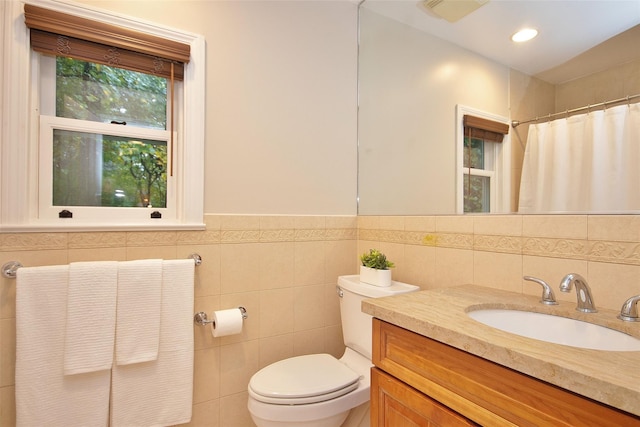 4 Southview Rd, Chappaqua, NY 10514 - full bath with toilet, tile walls, vanity, a shower with shower curtain, and wainscoting