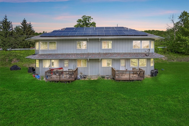 448 Old Mountain Rd, Port Jervis, NY 12771 - rear view of house featuring roof mounted solar panels, a yard, a deck, and a porch