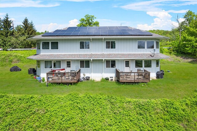 448 Old Mountain Rd, Port Jervis, NY 12771 - rear view of property featuring a deck, a yard, solar panels, and board and batten siding