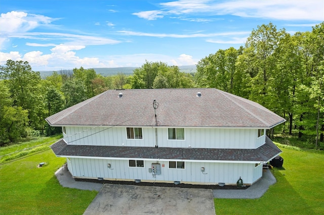 448 Old Mountain Rd, Port Jervis, NY 12771 - rear view of property featuring a yard, roof with shingles, and board and batten siding