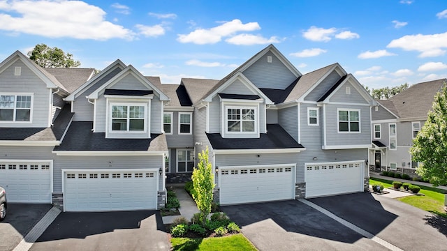 37 Lindentree Ln, Middletown, NY 10940 - view of front of home with stone siding, driveway, an attached garage, and roof with shingles