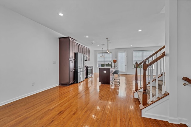 37 Lindentree Ln, Middletown, NY 10940 - kitchen featuring stainless steel appliances, a kitchen breakfast bar, a sink, baseboards, and recessed lighting