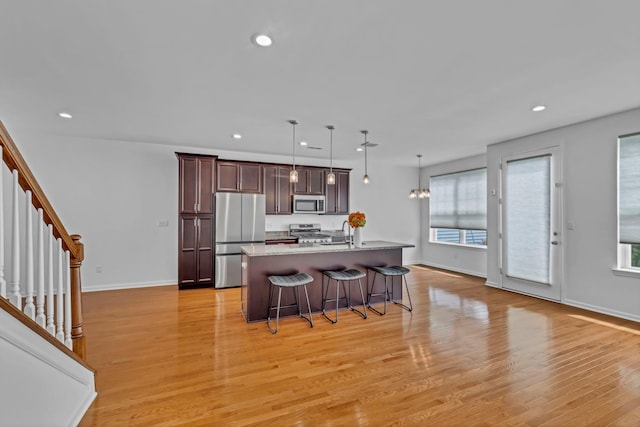 37 Lindentree Ln, Middletown, NY 10940 - kitchen featuring appliances with stainless steel finishes, a kitchen breakfast bar, a center island with sink, healthy amount of natural light, and recessed lighting