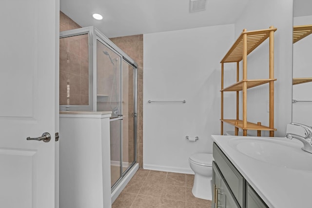 37 Lindentree Ln, Middletown, NY 10940 - bathroom featuring a stall shower, tile patterned floors, vanity, toilet, and baseboards