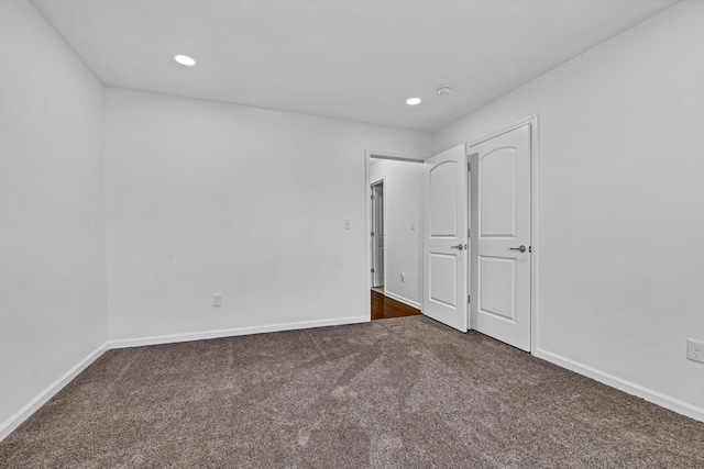 37 Lindentree Ln, Middletown, NY 10940 - unfurnished bedroom with dark carpet, baseboards, and recessed lighting