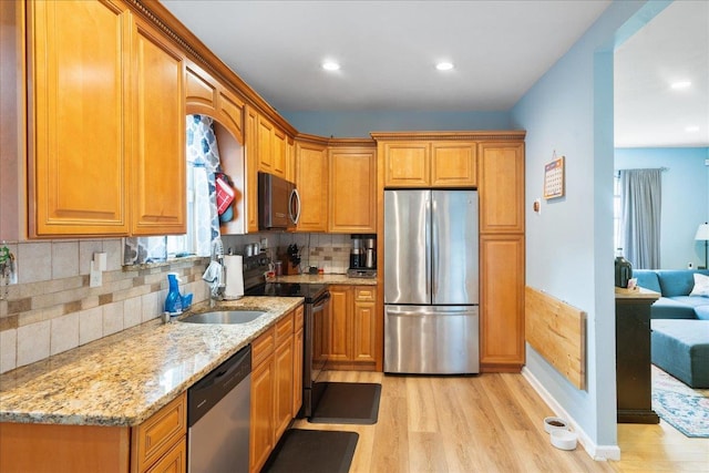 545 Mount Ave, West Babylon, NY 11704 - kitchen with stainless steel appliances, light wood-style flooring, light stone counters, tasteful backsplash, and recessed lighting