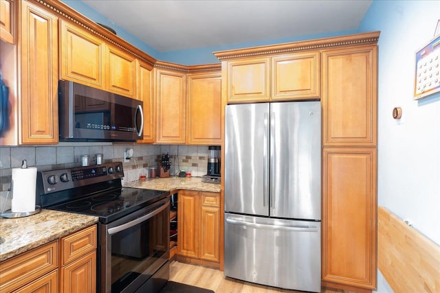 545 Mount Ave, West Babylon, NY 11704 - kitchen with freestanding refrigerator, electric stove, light stone counters, and backsplash