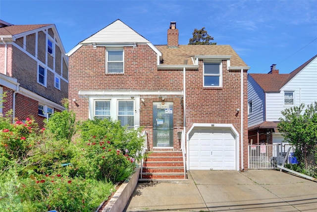 34-08 Murray Ln, Flushing, NY 11354 - view of front facade with brick siding, a chimney, concrete driveway, and an attached garage