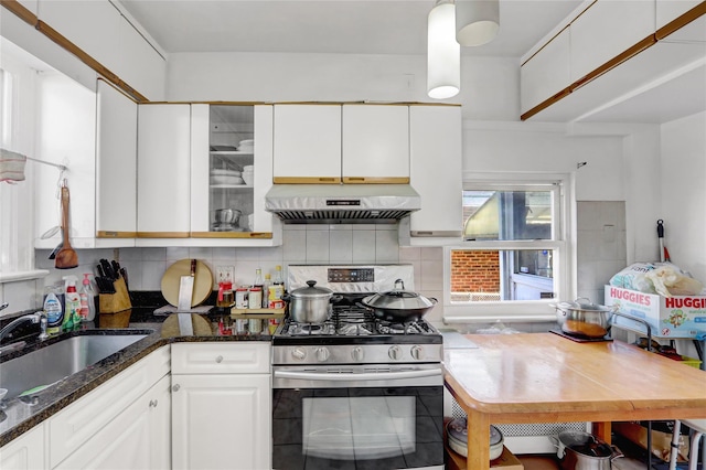 34-08 Murray Ln, Flushing, NY 11354 - kitchen featuring under cabinet range hood, stainless steel range with gas stovetop, a sink, white cabinets, and decorative backsplash