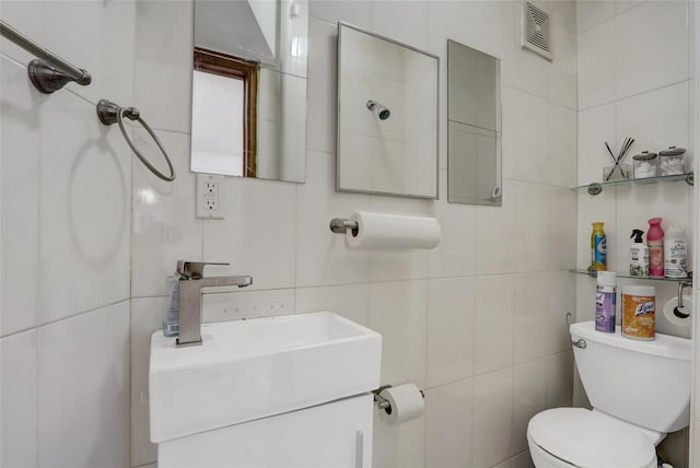 34-08 Murray Ln, Flushing, NY 11354 - bathroom with tile walls, toilet, and vanity