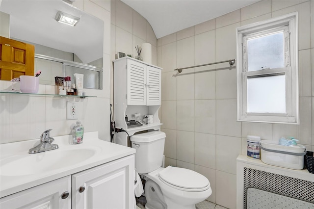 34-08 Murray Ln, Flushing, NY 11354 - bathroom with radiator, a stall shower, toilet, plenty of natural light, and tile walls