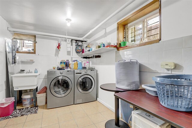 34-08 Murray Ln, Flushing, NY 11354 - laundry area with washer and clothes dryer, tile walls, and tile patterned flooring