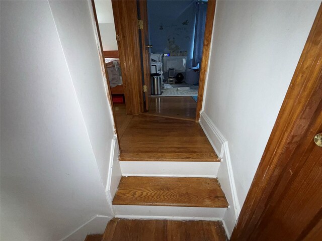 34-08 Murray Ln, Flushing, NY 11354 - stairs featuring wood finished floors and baseboards