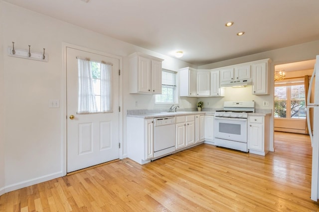 20 S St S, Highland Falls, NY 10928 - kitchen with white appliances, light countertops, light wood finished floors, a sink, and under cabinet range hood
