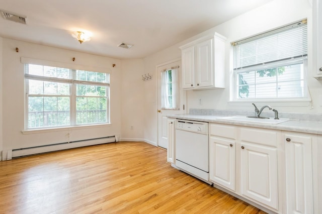 20 S St S, Highland Falls, NY 10928 - kitchen featuring white dishwasher, baseboard heating, light wood-style flooring, light countertops, and white cabinetry