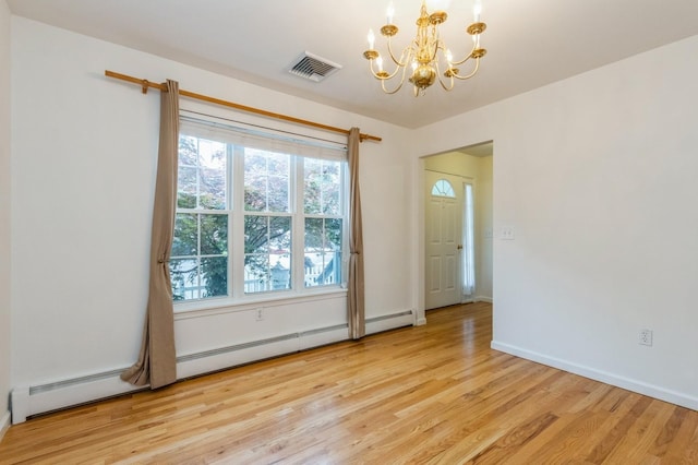 20 S St S, Highland Falls, NY 10928 - spare room featuring a chandelier, light wood-style flooring, and baseboards