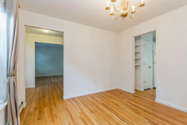 20 S St S, Highland Falls, NY 10928 - spare room featuring a chandelier, light wood finished floors, and baseboards